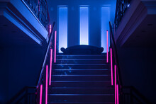 Neon Background. Dark Blue And Red Neon Stairs At The Night. Night Club, Bar, Concert Or Studio Room. Fluorescent Laser Light. 