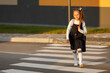 © Ruslan Ivantsov - schoolgirl crosses the road at a pedestrian crossing