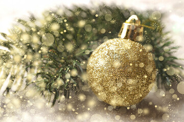 Wall Mural - Christmas background with christmas tree branch and golden christmas ball, Selective focus, golden snowflakes