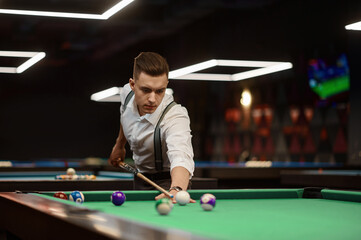 Portrait of man playing billiard