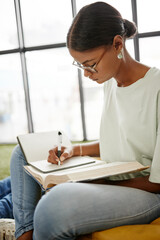 Poster - University student woman writing notebook, reading research and learning for education, knowledge and project at campus in Colombia. College youth study textbook, exam notes and school library books