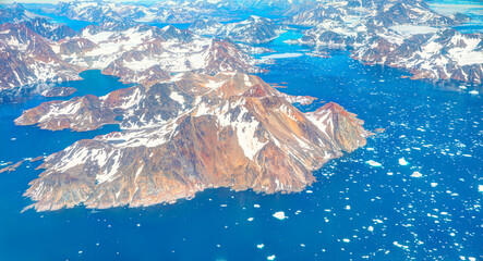 View from airplane of melting polar ice cap Greenland