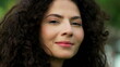 © Marco - One hopeful hispanic young woman looking up at sky with FAITH. Spiritual South American female person