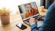 © MYDAYcontent - Back view of man look at laptop screen chatting with girl friend on gadget. Man sitting at desk home talk on video call with woman, remotely connection people concept.
