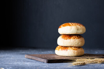 Traditional Turkish pastries pogaca on rustic table, famous bakery product