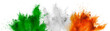 colorful irish tricolour flag in  green white orange color holi paint powder explosion isolated background. ireland  europe celebration soccer fans travel tourism concept