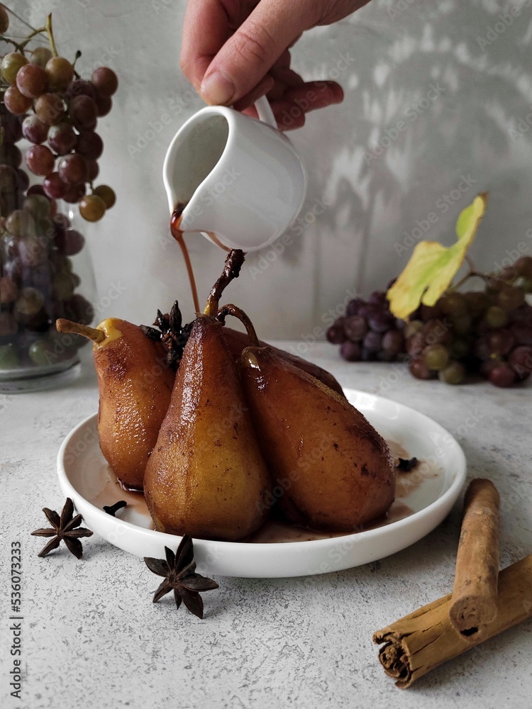 Pear dish. Pears were boiled in red wine syrup with spices such as ...