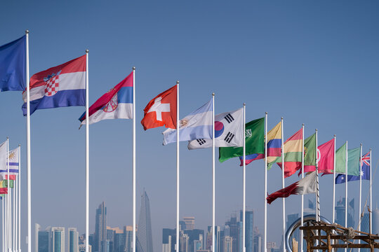 Wall Mural - Flags of nations qualified for World Cup 2022 Qatar at Doha Corniche, Qatar.