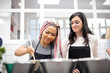 © ADDICTIVE STOCK - Content multi ethnic women stirring dish in pot at cooking workshop
