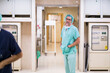 © ADDICTIVE STOCK - Relaxed surgeon standing in operating theater
