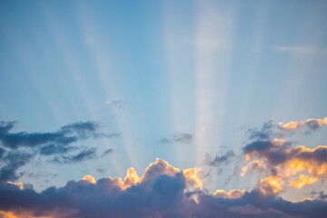 Wall Mural - sunset dramatic sky clouds with sunbeam