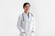 © Prostock-studio - Portrait of confident smiling millennial indian female doctor in white coat with stethoscope
