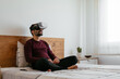 © ADDICTIVE STOCK - Guy experiencing virtual reality on bed