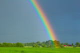 Fototapeta Tęcza - rainbow in the sky.Picturesque view of beautiful rainbow and blue sky on sunny day