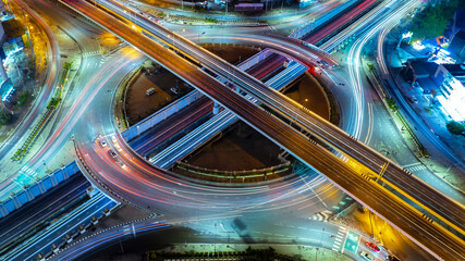 Poster - Expressway top view, Road traffic an important infrastructure, car traffic transportation above intersection road, aerial view cityscape of advanced innovation, financial technology