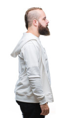 Sticker - Young caucasian hipster man wearing sport clothes over isolated background looking to side, relax profile pose with natural face with confident smile.