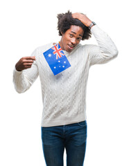 Poster - Afro american man flag of Australia over isolated background stressed with hand on head, shocked with shame and surprise face, angry and frustrated. Fear and upset for mistake.