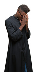 Canvas Print - Young african american priest man over isolated background with sad expression covering face with hands while crying. Depression concept.