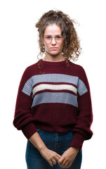 Sticker - Beautiful brunette curly hair young girl wearing glasses over isolated background with serious expression on face. Simple and natural looking at the camera.