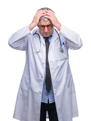 Wall Mural - Handsome senior doctor man over isolated background suffering from headache desperate and stressed because pain and migraine. Hands on head.