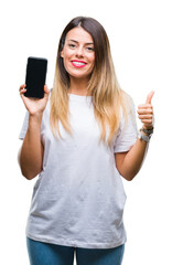 Sticker - Young beautiful woman showing blank screen of smartphone over isolated background happy with big smile doing ok sign, thumb up with fingers, excellent sign