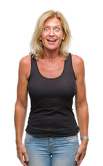 Sticker - Middle age blonde woman over isolated background afraid and shocked with surprise expression, fear and excited face.