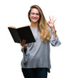 © Krakenimages.com - Young beautiful blonde woman reading a book over isolated background doing ok sign with fingers, excellent symbol