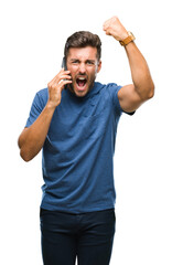 Sticker - Young handsome man talking on smartphone over isolated background annoyed and frustrated shouting with anger, crazy and yelling with raised hand, anger concept