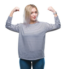 Sticker - Young blonde woman over isolated background showing arms muscles smiling proud. Fitness concept.