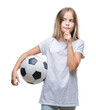 © Krakenimages.com - Young beautiful girl holding soccer football ball over isolated background serious face thinking about question, very confused idea