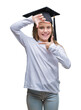 © Krakenimages.com - Young beautiful girl wearing graduate cap over isolated background smiling making frame with hands and fingers with happy face. Creativity and photography concept.