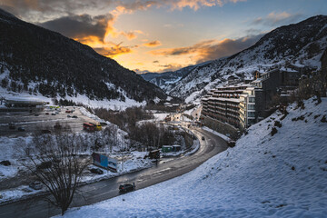 El Tarter village at dusk or night fall with last sunlight illuminating sunset sky in Pyrenees mountains, Grandvalira, Andorra