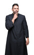 © Krakenimages.com - Young Christian priest over isolated background with hand on chin thinking about question, pensive expression. Smiling with thoughtful face. Doubt concept.