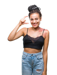 Sticker - Young braided hair african american with pigmentation blemish birth mark over isolated background smiling and confident gesturing with hand doing size sign with fingers while looking and the camera