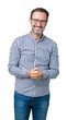 © Krakenimages.com - Handsome middle age elegant senior man wearing glasses over isolated background Hands together and fingers crossed smiling relaxed and cheerful. Success and optimistic