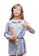 Sticker - Young blonde child holding big pencil happy with big smile doing ok sign, thumb up with fingers, excellent sign