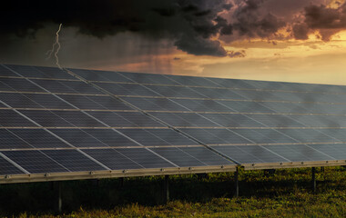 solar panels with a storm coming in the background