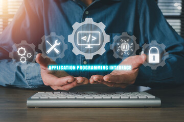 api - application programming interface, man hand holding vr screen api icon on office desk, softwar