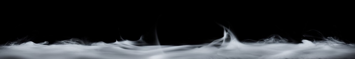 Wall Mural - floor covered in smoke or fog swirling upwards. dramatic smoke or fog effect for spooky halloween ba