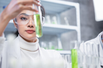 pharmaceutical science laboratory of health care cosmetic research, apothecary scientist working to test a organic herb drug of chemical medicine experiment with chemist doctor, beaker glasses tools