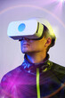© nuclear_lily - Man is using virtual reality headset. Concept of virtual, augmented and extended reality and metaverse.
