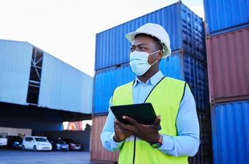 Man, logistics worker, and covid with a tablet to check inventory in mask with cargo container in background. Black industry employee working, shipping and health and safety at work site.