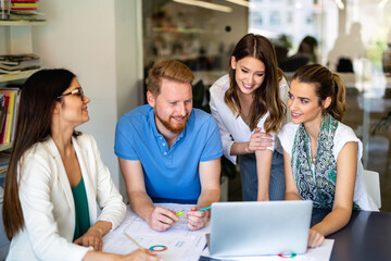 Wall Mural - Group of happy multiethnic business people working together, sharing ideas in corporate office.