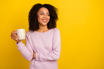 Wall Mural - Photo of young pretty woman drink espresso wonder look empty space isolated over yellow color background