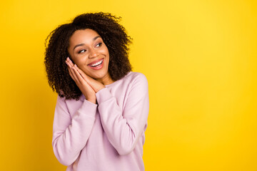 Wall Mural - Photo of young lovely woman hands touch cheeks curious look empty space isolated over yellow color background