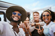 © Siphosethu Fanti/peopleimages.com - Travel, adventure and selfie with friends celebrating freedom and showing hand peace sign outdoors. Diversity, nature and fun with happy men and women on a road trip, bonding and enjoying vacation