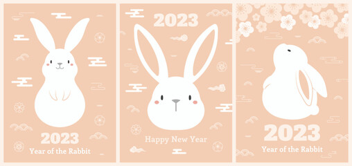 Wall Mural - 2023 Chinese, Lunar New Year kawaii rabbits poster, banner collection with flowers, clouds, abstract elements, typography. Cute zodiac sign. Holiday card design. Vector illustration. Flat style.