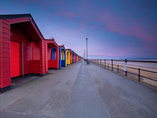 Wall Mural - Saltburn Beach Huts at sunset