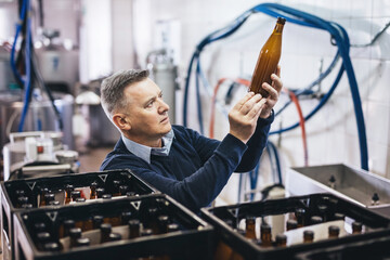 Wall Mural - Man preparing craft beer from brewery for shipment.