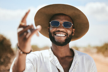 Sticker - Rock hand sign, black man and sunglasses stand on dirt road traveling, outdoor and adventure with cool hat. Portrait, African American male and smile on holiday, journey and countryside with style.